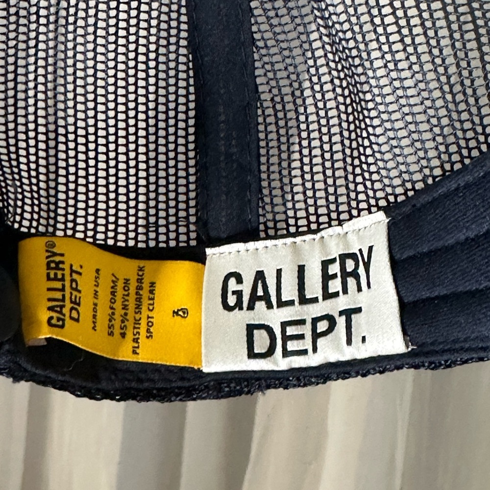 Black and yellow gallery department trucker hat
